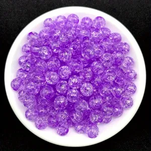 Macro view of 8mm purple transparent crackle acrylic beads for DIY jewelry making