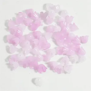Detail view of 11mm lily of the valley shaped beads in pink and white colors for DIY