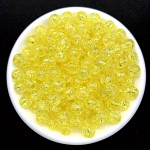 Close-up of 8mm yellow acrylic crackle beads for DIY jewelry making and crafting.
