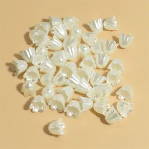 Close-up of 11mm pearl-colored flower-shaped acrylic beads for DIY jewelry