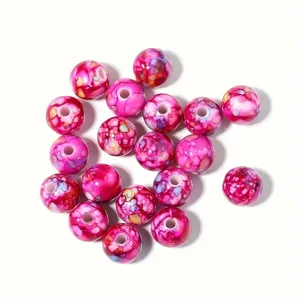 Vista detallada de cuentas de acrílico rosa craquelado de 8-10mm para creación de joyas