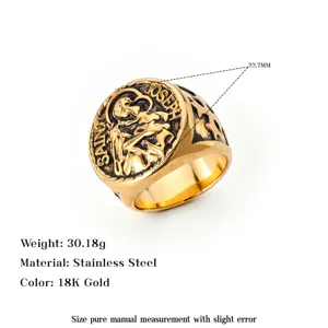 Detail of retro men's stainless steel ring featuring Saint Joseph relief and gold finish