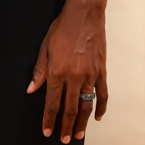 Vintage silver stainless steel embossed band ring for men worn on male hand model