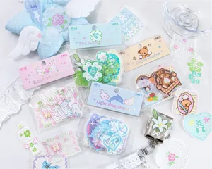 Detailed view of pastel pixel art stickers for DIY scrapbooking and journal decoration