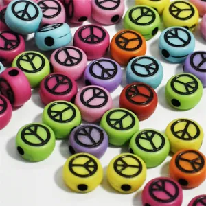 Close-up of 7mm colorful acrylic beads with black peace sign symbols for DIY jewelry.