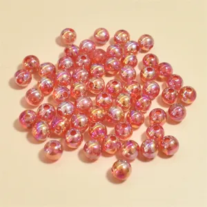 Close-up of 8mm AB iridescent pink acrylic round beads for DIY jewelry making