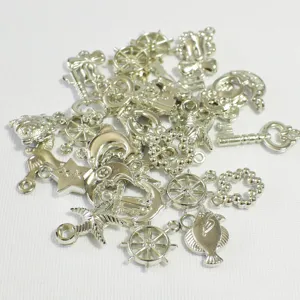 Detailed shot of assorted silver plated charms for DIY jewelry making and crafts