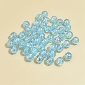 Macro shot of 8mm light blue AB iridescent acrylic beads for DIY jewelry making projects