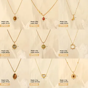 Selection of nine gold stainless steel necklaces with diverse gemstone pendant designs
