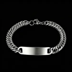 Detail shot of polished stainless steel Cuban link bracelet with blank ID plate
