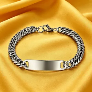Close-up detail of a polished stainless steel Cuban link bracelet with a blank ID tag