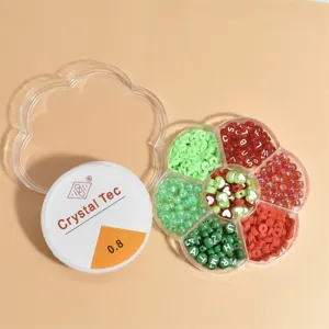 Detail of flower-shaped bead kit with polymer clay discs and elastic string