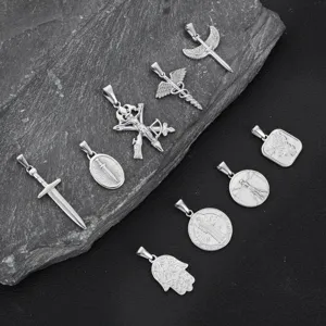 Variety of stainless steel vintage pendants including cross, angel wings, and hamsa hand
