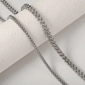 Macro view showing the intricate texture and weave of stainless steel Franco wheat chain