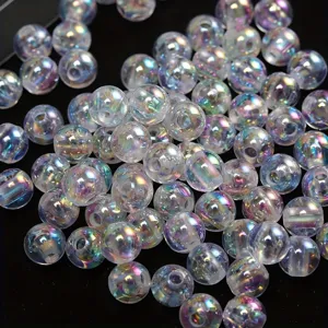 Close-up of transparent AB iridescent acrylic round beads for jewelry making