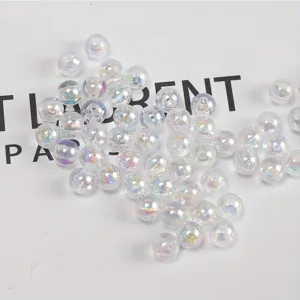 Close-up of 4-8mm clear AB acrylic round beads with iridescent finish for DIY jewelry.