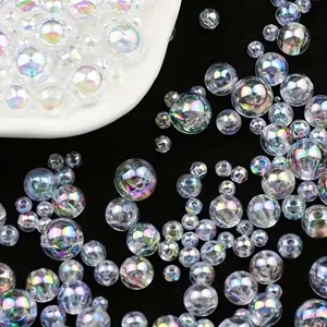 Macro view of transparent AB colorful acrylic beads for DIY jewelry on black background