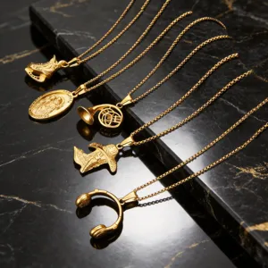 Pendentifs vintage en acier inoxydable plaqué or 18 carats avec instruments de musique
