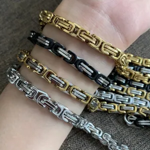 Detail view of men's Byzantine chain bracelets in gold, silver, and dual-tone finishes