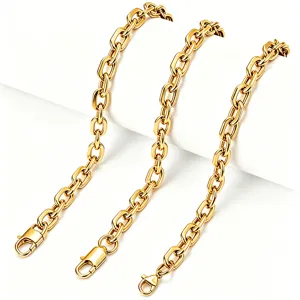 Macro view of chunky gold stainless steel paperclip chain necklaces with lobster clasps.