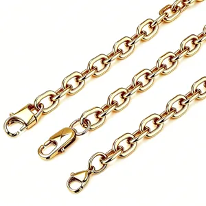 Detailed macro view of gold-plated stainless steel paperclip chains with lobster clasps.