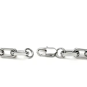 Macro detail view of silver stainless steel paperclip chain with lobster clasp closure