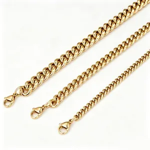 Detail view of three gold-plated stainless steel Cuban link chains in varying thicknesses