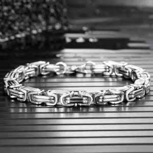 Macro view of a heavy Byzantine link bracelet for men crafted in premium stainless steel