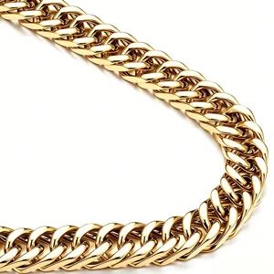 Macro detail of high polished thick Cuban chain in stainless steel with golden finish