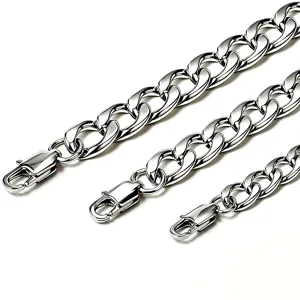 Close-up showing three thicknesses of polished stainless steel Cuban link chains