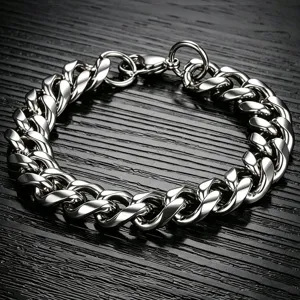Macro view of thick silver stainless steel Cuban link chain with polished finish.