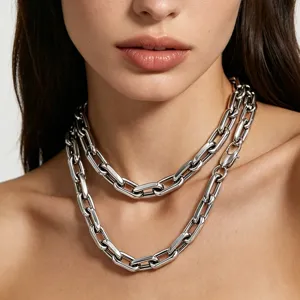 Detailed view of polished silver stainless steel paperclip link necklace on neck
