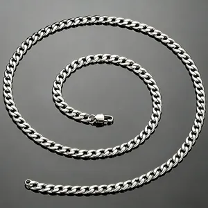 Macro detail of a high-polished silver stainless steel Cuban link necklace spiral