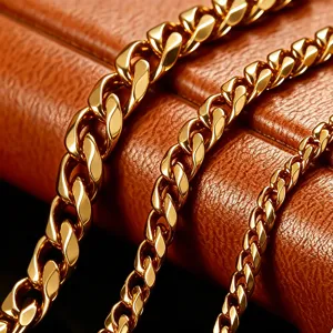 Detail view of gold-plated Cuban link necklaces in three different thicknesses