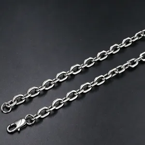 Detailed macro view of high-quality stainless steel paperclip necklace links and clasp