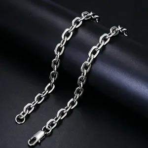 Detailed close-up of polished stainless steel paperclip chain necklace with lobster clasp