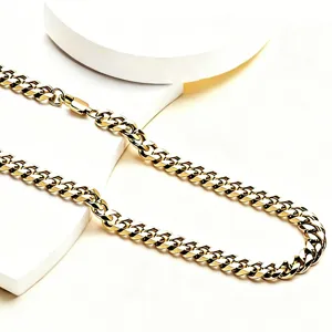 High-detail close-up of polished 18K gold-plated Cuban link chain hip-hop necklace