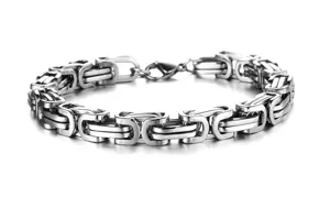 Close-up detail of a polished stainless steel Byzantine chain bracelet for men