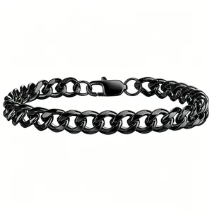 Macro view of polished black titanium steel Cuban link bracelet with lobster clasp