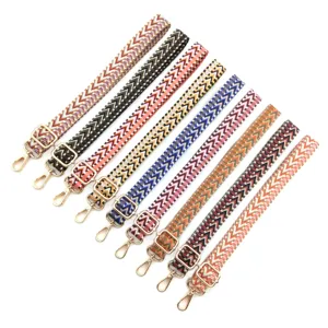 Detail view showing variety of woven adjustable bag straps with chevron patterns.