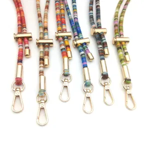 Detail of colorful retro braided phone lanyards with elegant gold-tone metal clasps