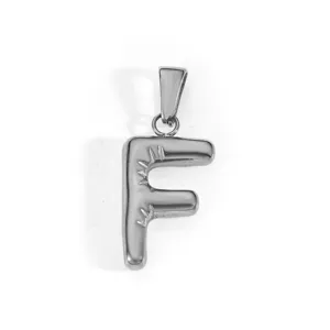 Close-up macro view of a shiny silver stainless steel capital letter F alphabet pendant