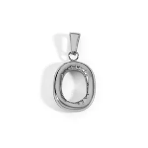 Detailed view of a silver stainless steel capital letter O pendant with inner notches