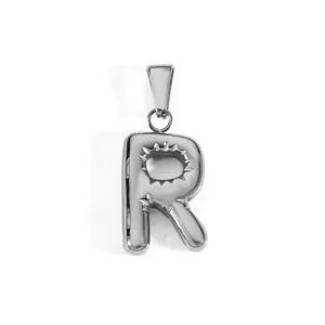 Detailed view of silver stainless steel letter R bubble pendant with sunburst engraving