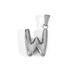 Macro detail of a silver stainless steel puffy capital letter W alphabet pendant