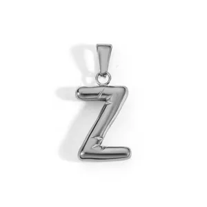 Macro view of a polished stainless steel letter Z pendant in silver color