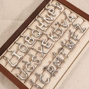 Stainless steel 26 uppercase letter pendants set for DIY jewelry making in a tray