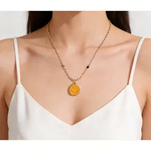Stylish gold stainless steel necklace with rainbow beads and yellow smiley pendant