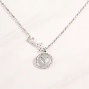Elegant silver stainless steel necklace featuring a Lucky script charm and heart coin pendant