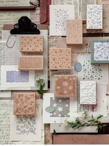 Decorative vintage beechwood stamps with floral and star patterns for bullet journaling